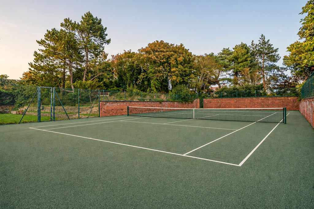 Private outdoor tennis court at Birkdale